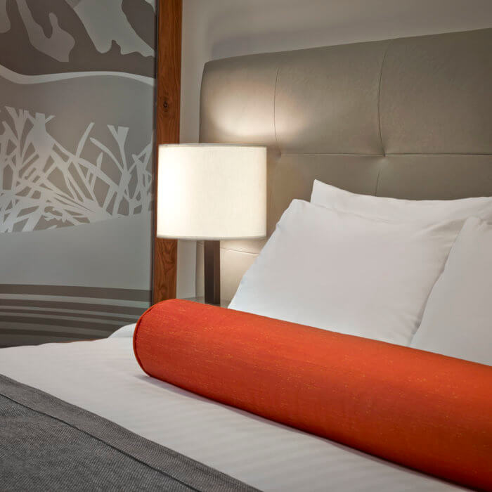 Best Western Hotel Interior Design Bed Orange Bolster Lamp